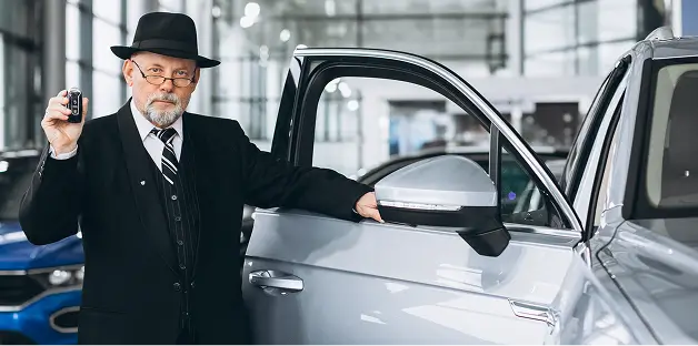 Chauffeur with luxury vehicle