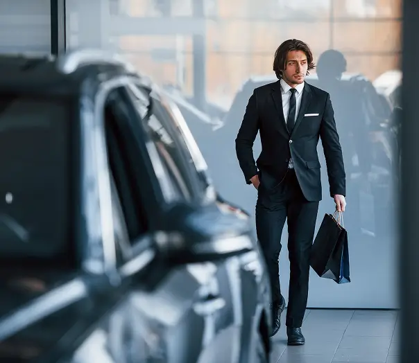 Executive with luxury corporate vehicles